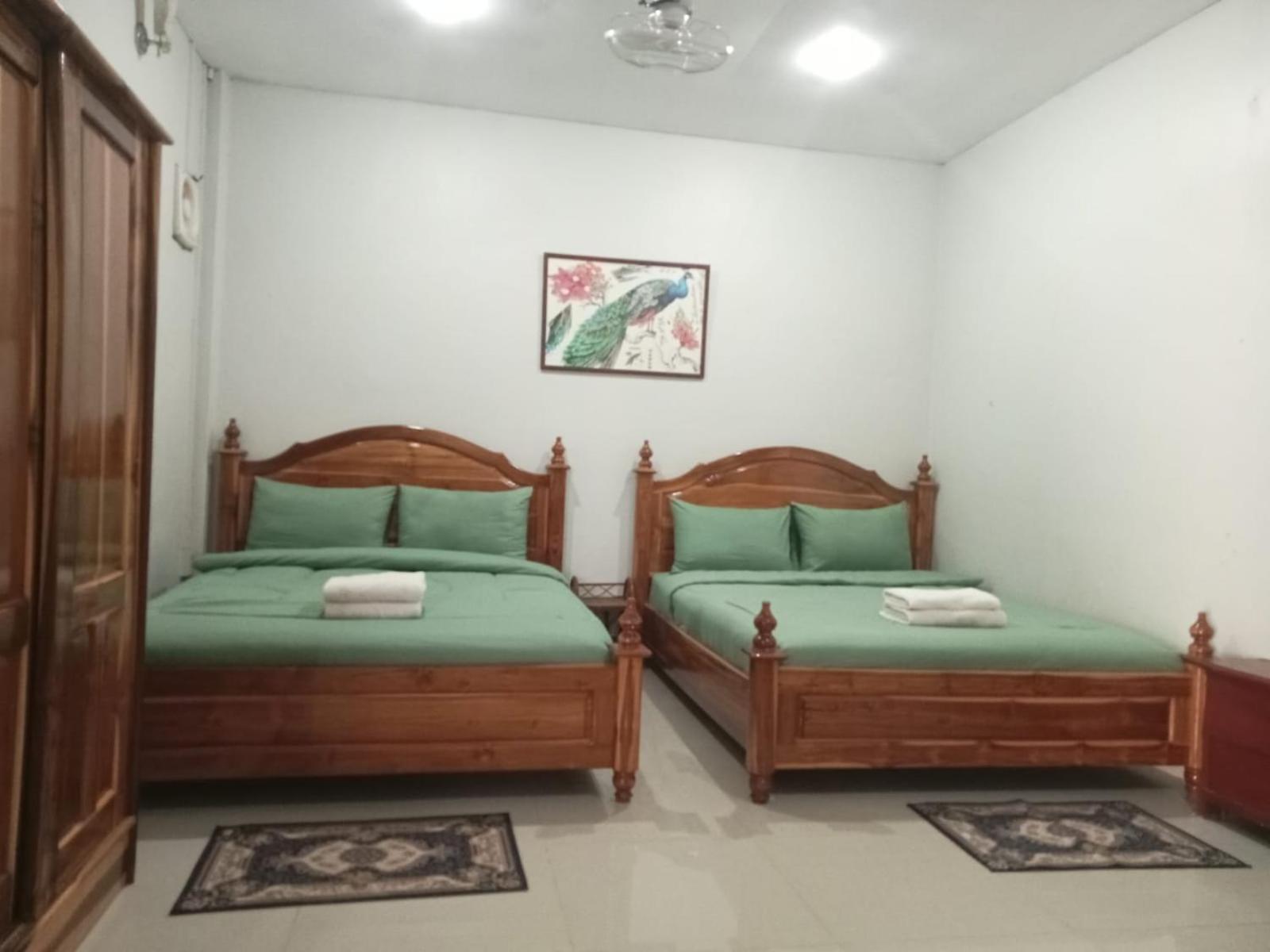 Erawan Guesthouse Паксе Экстерьер фото